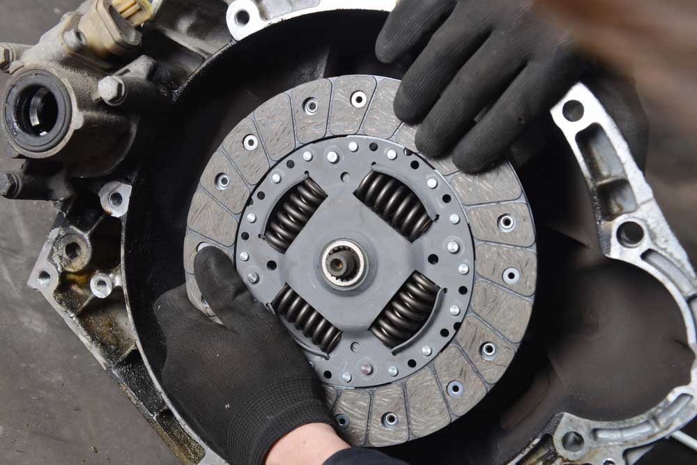 Mechanic working on a clutch assembly